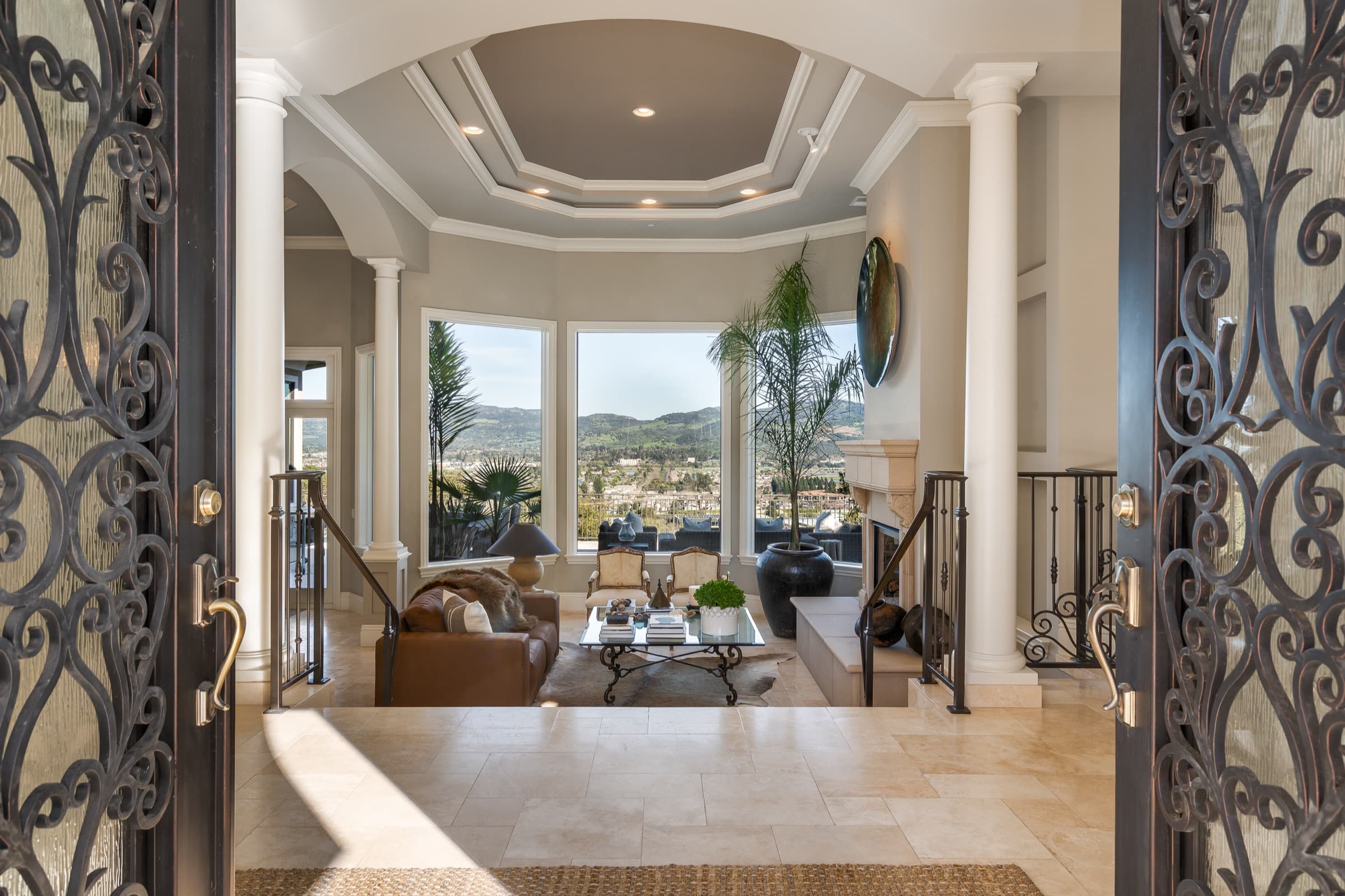 The view through the front doors into the living room and out to the valley.